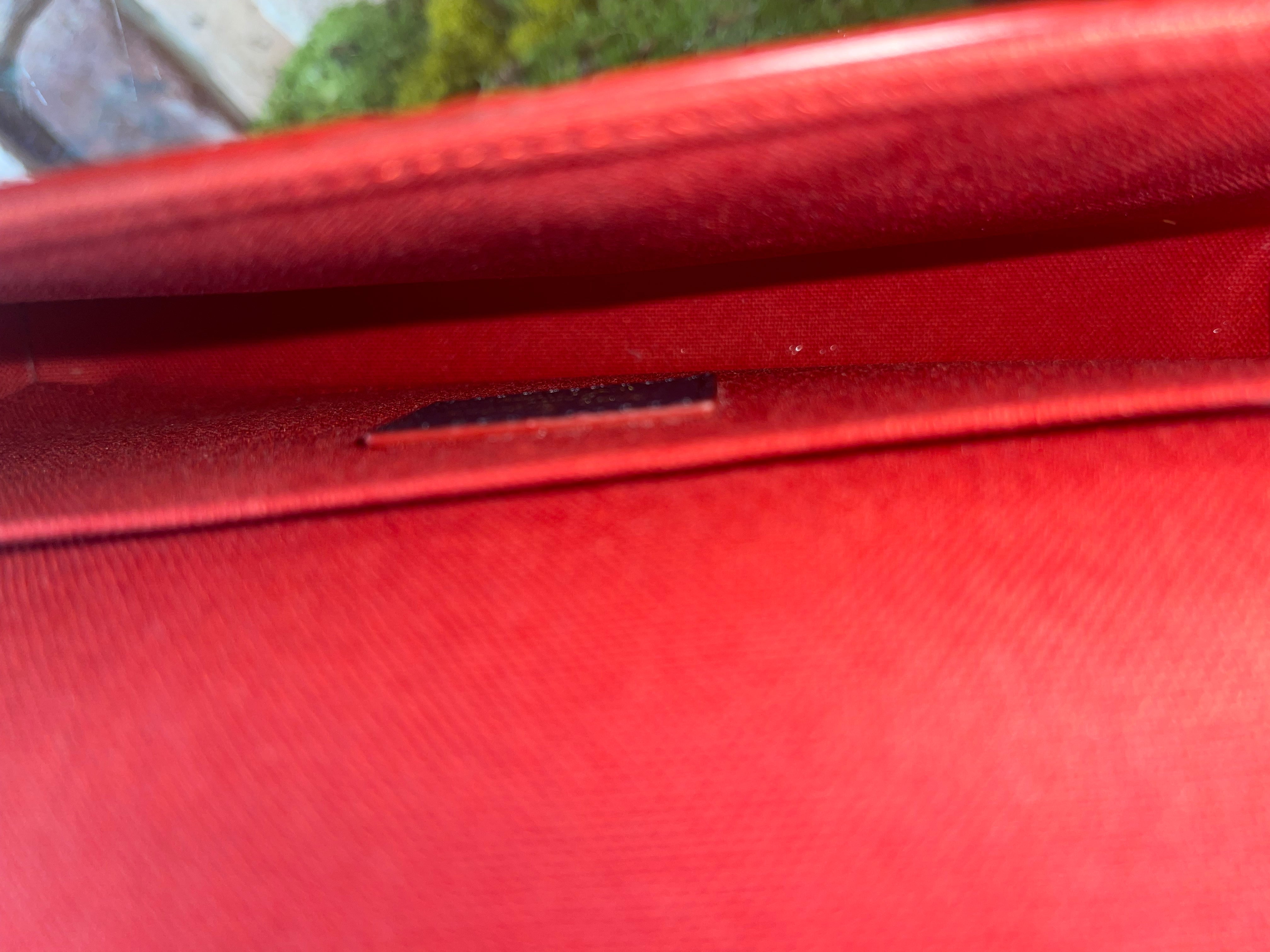 Authentic Louis Vuitton Marine Rouge Empreinte Leather Pochette