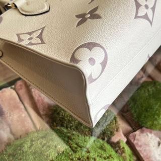 LOUIS VUITTON Onthego PM Creme Bois de Rose Giant Monogram Empreinte Leather Tote Bag