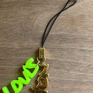 LOUIS VUITTON Green Louis Vuitton Lettering Gold Tone Bag Charm