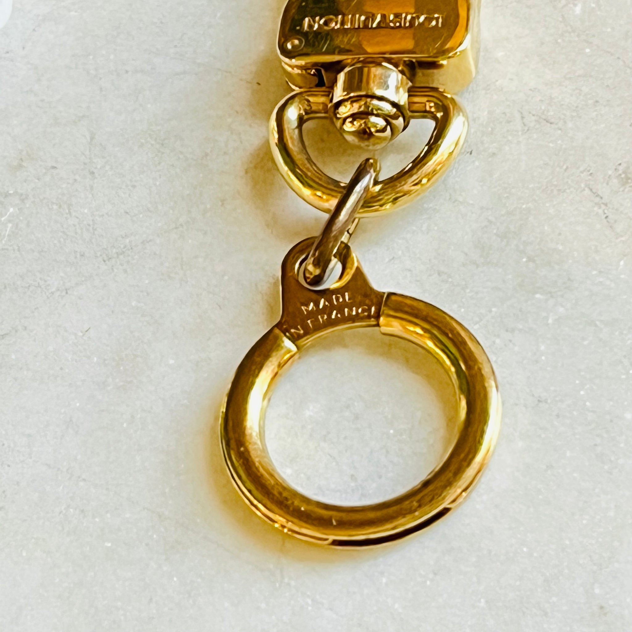 LOUIS VUITTON Goldtone Bolt Key Hold And Bag Extender - The Purse Ladies
