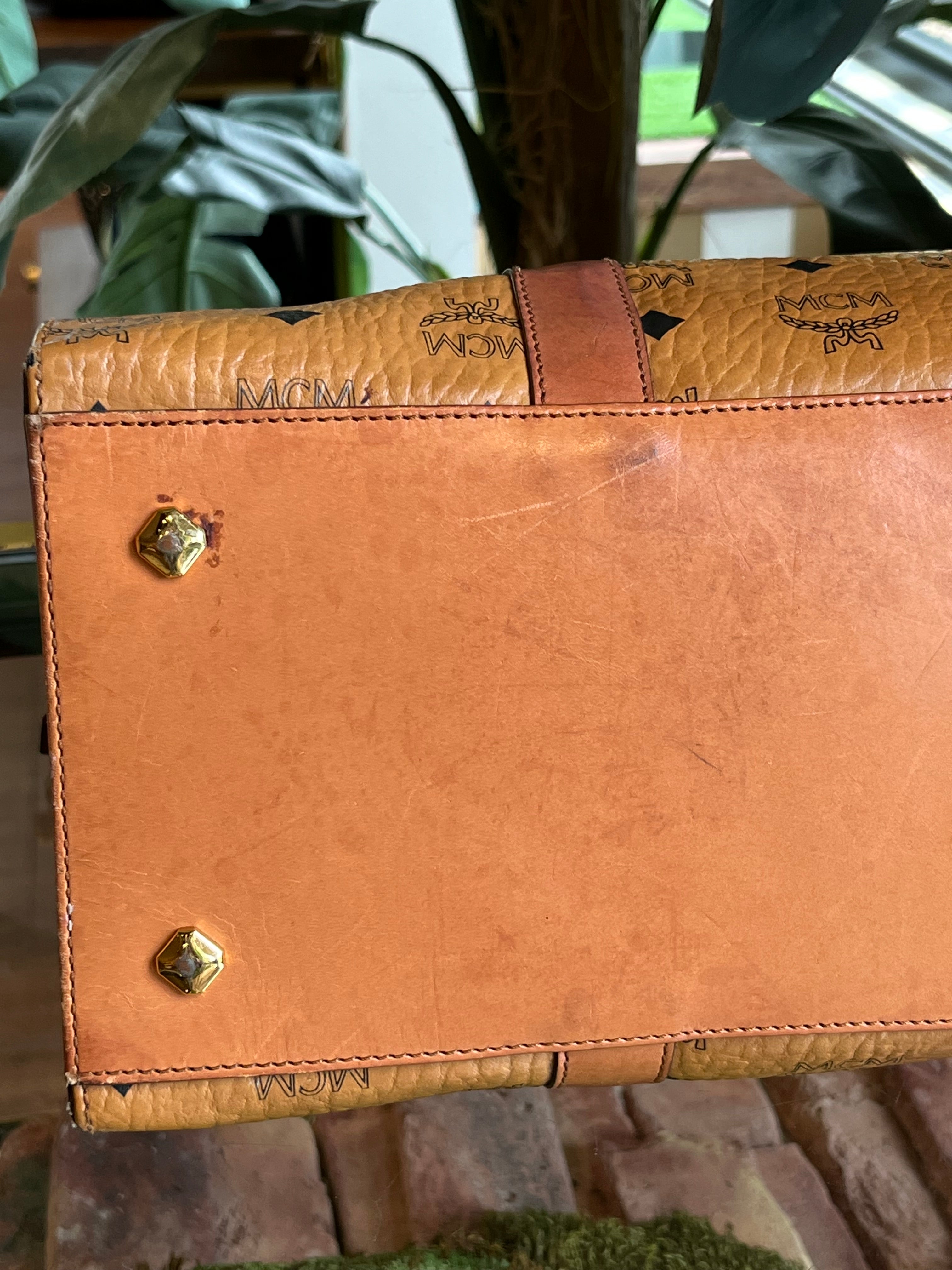 Sold at Auction: MCM Cognac Visetos Coated Canvas Barrel Bag, with brushed  gold hardware, opening to a cognac silk lined interior with a small zip  co