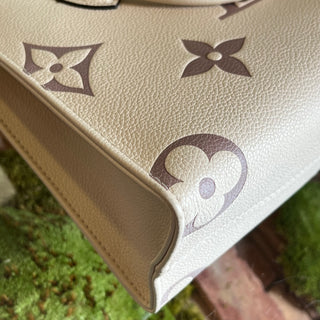 LOUIS VUITTON Onthego PM Creme Bois de Rose Giant Monogram Empreinte Leather Tote Bag