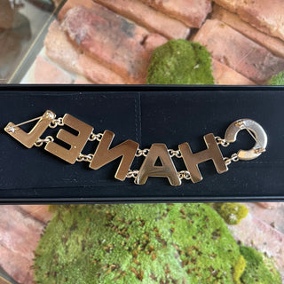 CHANEL Black Strass Logo Metal Brooch